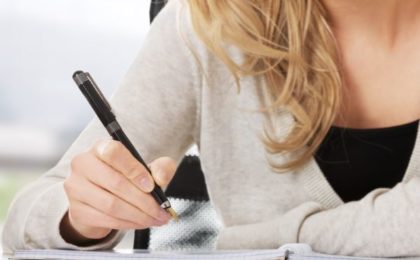 Dear procrastiwriter - writing in a notebook